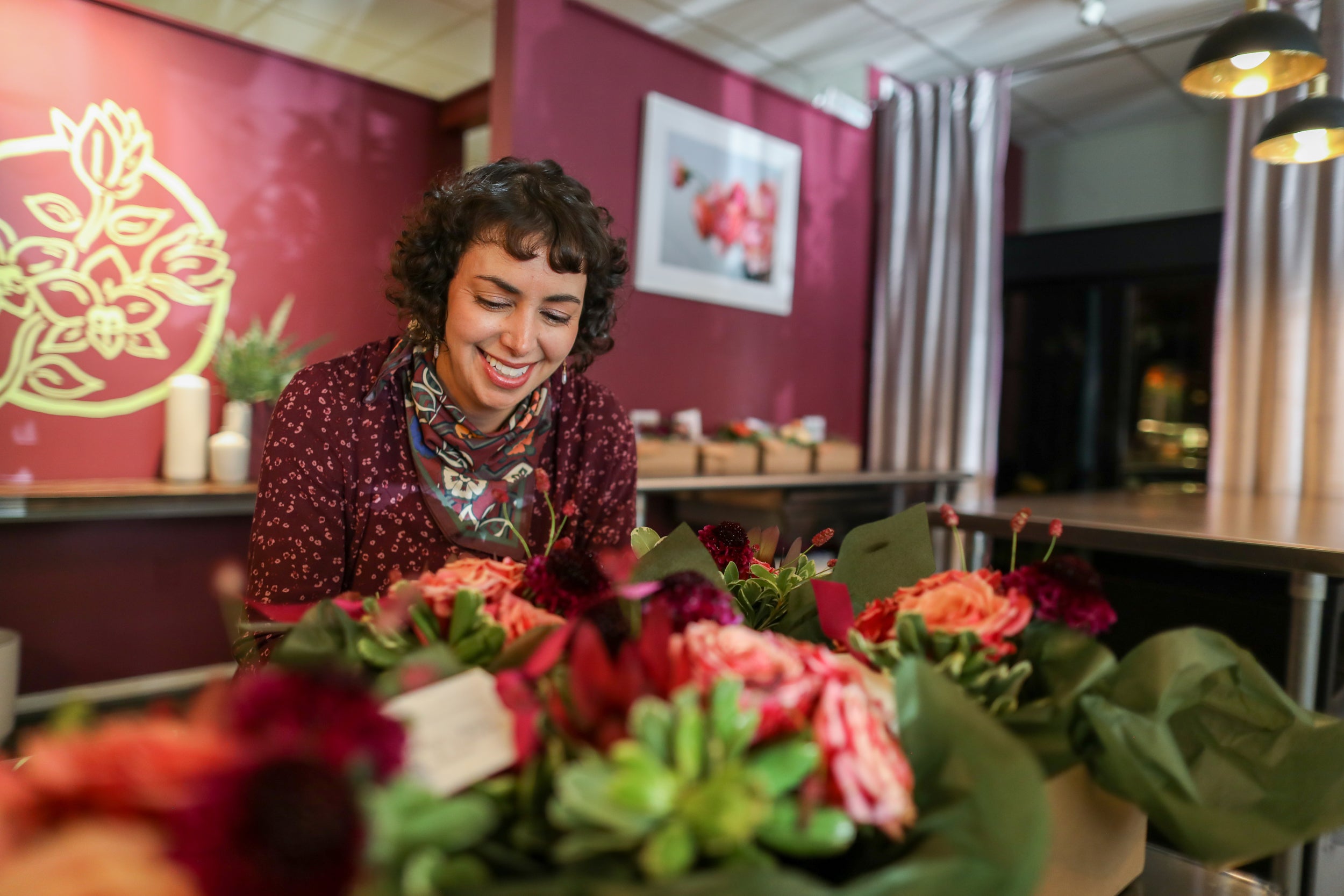 Owner of Cymbidium Floral at red flower displays