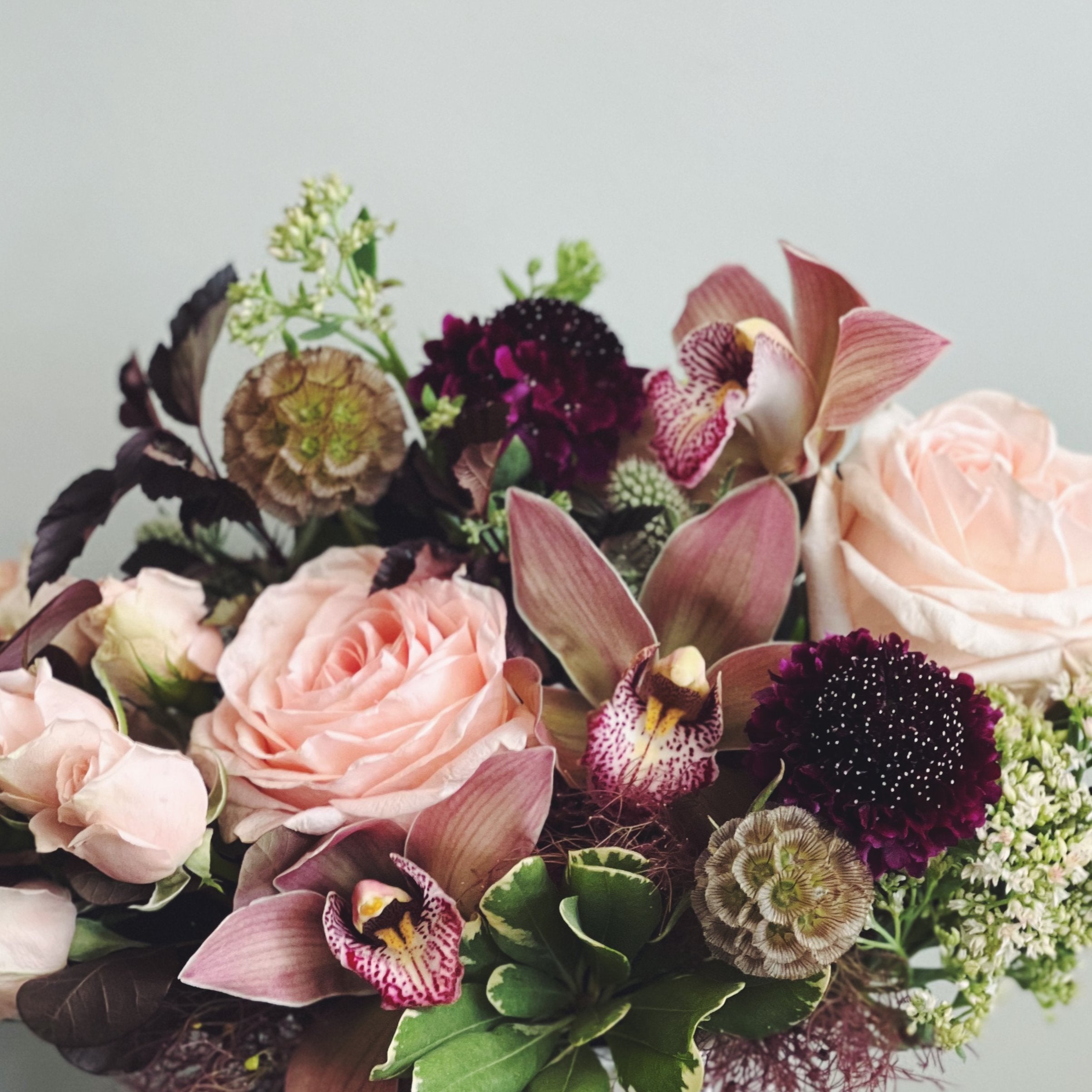 Peach and plum flower design from Cymbidium Floral 