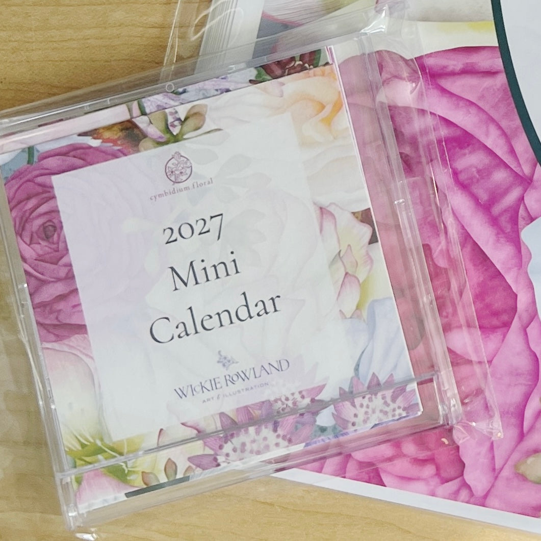 A floral 2027 wall calendar featuring twelve illustrations by local artist, Wickie Roland.