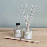 Two diffusers in 'New Leaf' scent featuring aloe, moss and green clover. 