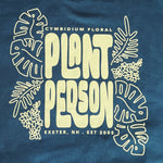 Deep green sweatshirt with 'Plant Person' text and leaf designs on a blue background