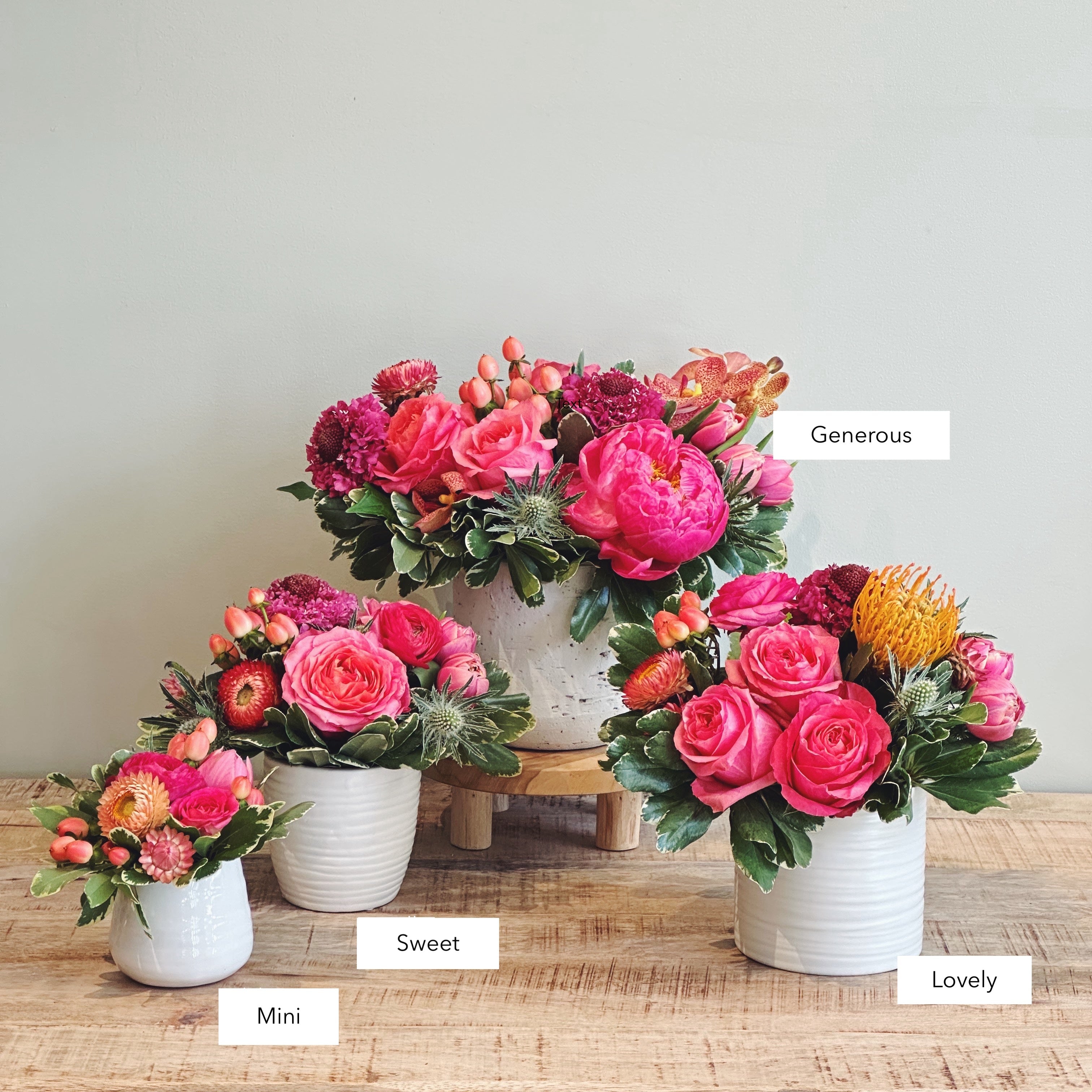 Three premium floral arrangements in bright cheerful colors with sizes labeled 'Mini', 'Sweet', 'Lovely, and 'Generous'.