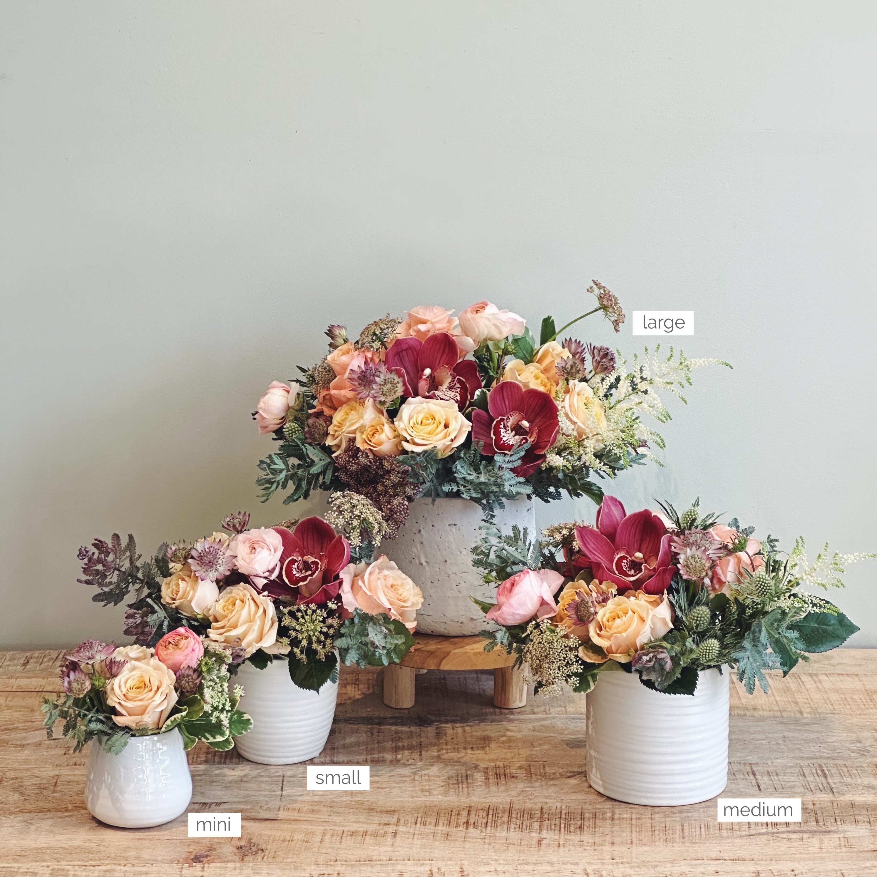 Four flower arrangements showing size for scale  