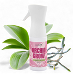 Orchid Grow fertilizer spray bottle with orchid leaves on a white background
