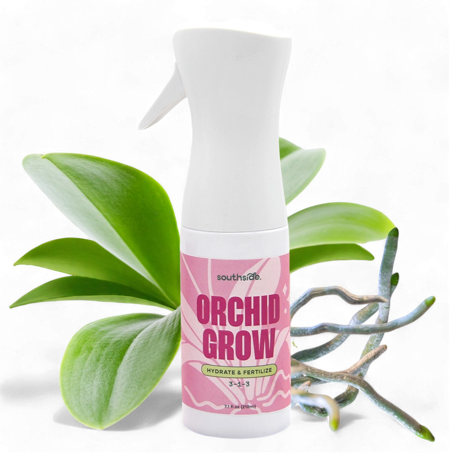 Orchid Grow fertilizer spray bottle with orchid leaves on a white background