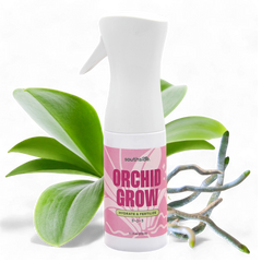Orchid Grow fertilizer spray bottle with orchid leaves on a white background