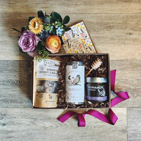 Feel Better Gift Box with mini flower arrangement, caramels, tea, honey, honey stick, and greeting card.
